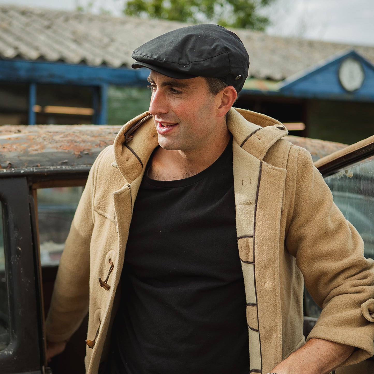 Jaxon & James British Millerain Schiebermütze aus gewachster Baumwolle - Schwarz